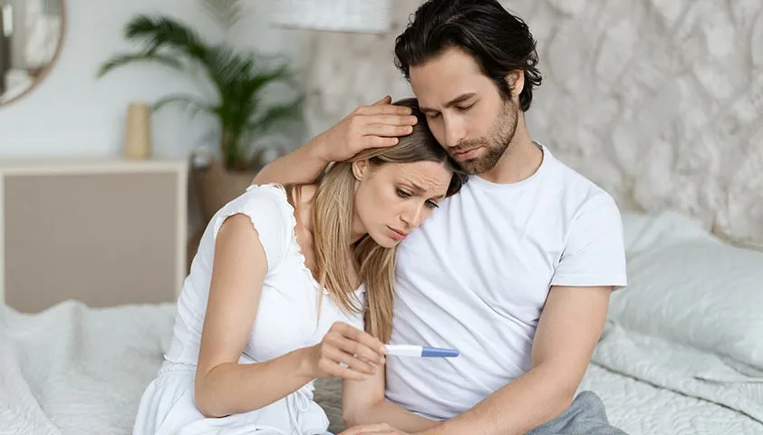 A partner comforting a woman during an emotional moment